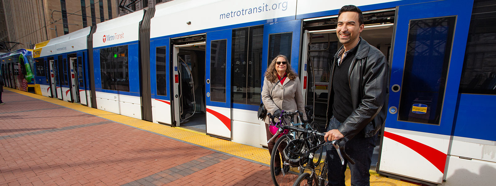 bikers getting off light rail