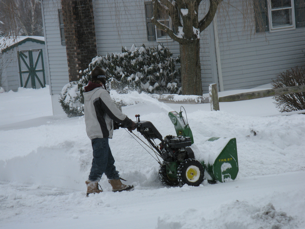 teen with snowblower