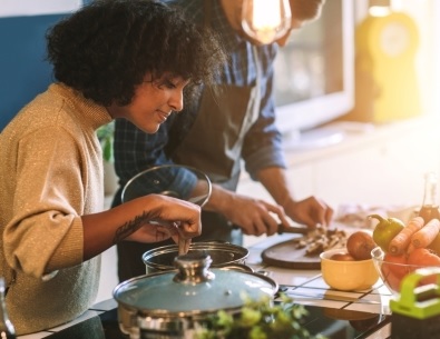 Young woman cooking in kitchen