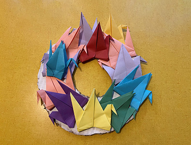 Kids art wreath made of origami swans