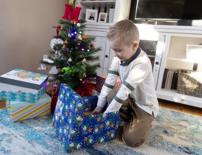 Boy opening Christmas present