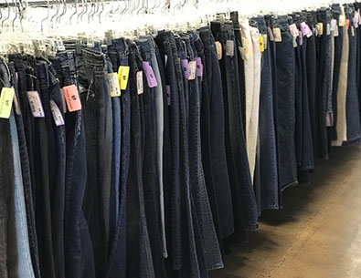 Jeans hanging on a rack at Arc's Value Village