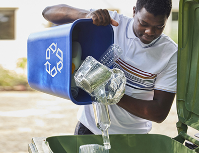 Man putting recycling in bin